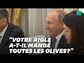 Vladimir poutine raille lemblme des tatsunis devant bolton et clate de rire