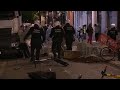 Police in Brussels break up crowds of people celebrating the end of curfew