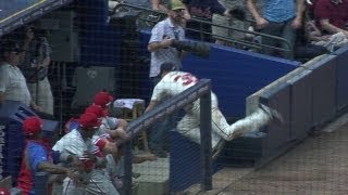 Elliot Johnson falls into dugout, while going for foul ball