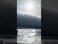 Beachgoers in Portugal witness a rare 'roll cloud' during a heatwave