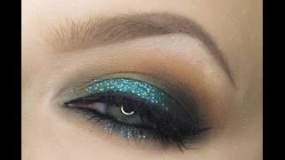 Dramatic green glitter makeup...