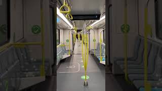 Guys run through train then one hits a pole and falls on the chairs