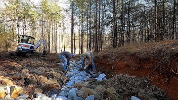 Installing Rip Rap for Drainage Ditch and Erosion Control