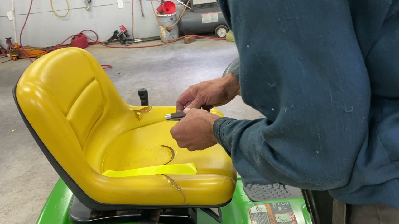 How to repair a John Deere lawn mower tractor seat.  100 series.  LA125