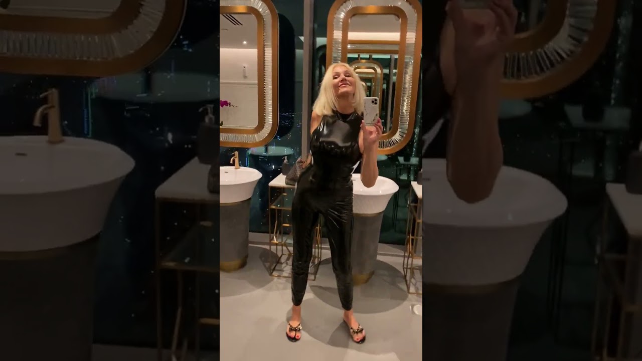 Beautiful mature girl in vinyl outfit 