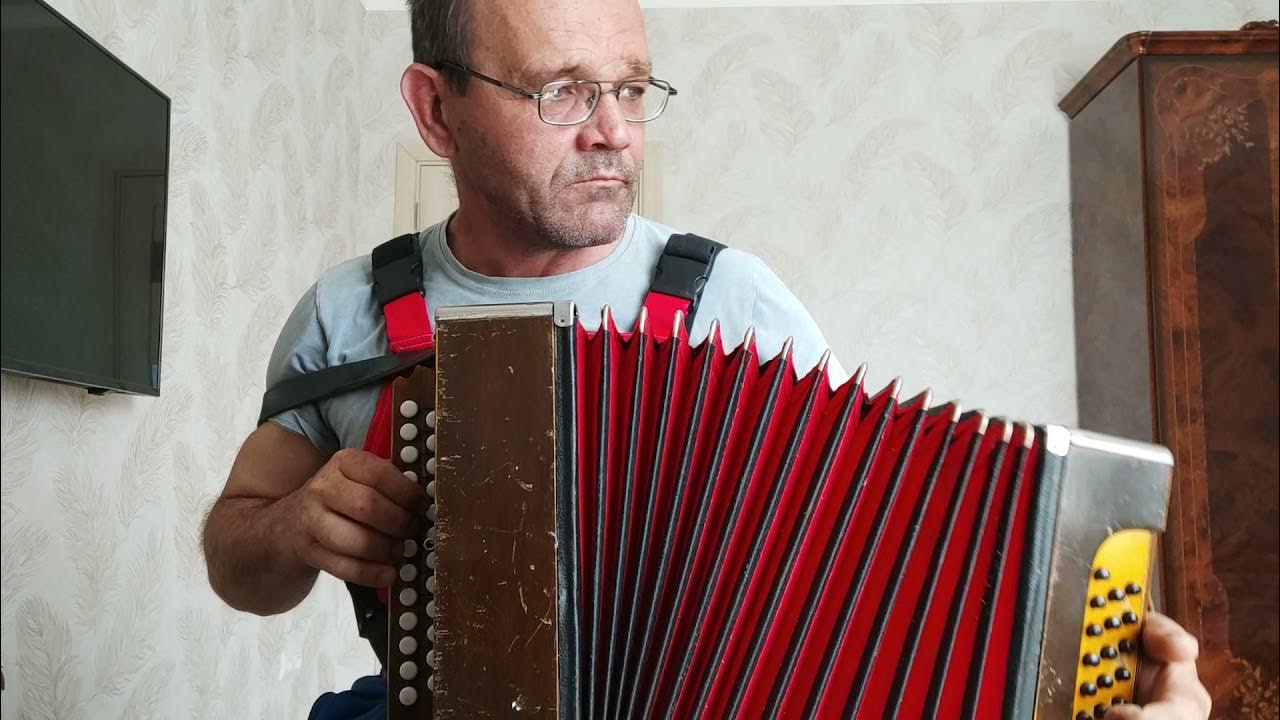В землянке под гармонь