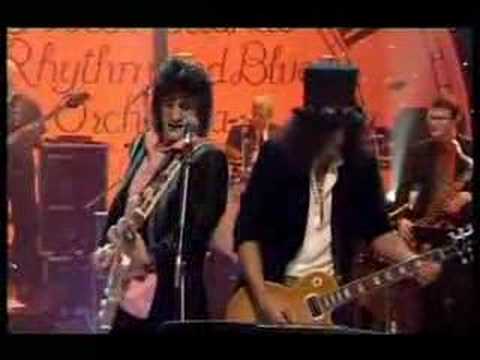 A Streaker on BBC's Jools Holland walks right past Ronnie Wood and Slash, Ronnie does a classic double take and gets completely put off singing, coming out with the immortal words 'what a huge knob!' Slash is largely unaware of the mayhem, hilarious!!!