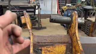 Bucket ear repair and pin replacement.