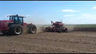 VERSATILE 2375 pulling Seeder and Air Cart