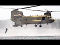 Soldiers Jumping from a CH-47 Chinook Helicopter During a Helocast in Kingsley Lake