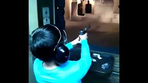 Louis Shooting a .22mm Ruger pistol at Bob's Gun Shop