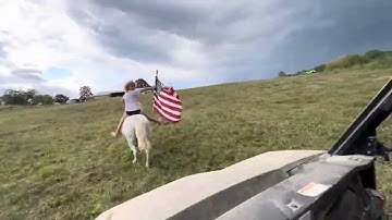 Bareback riding carrying the American flag running free with no hands 