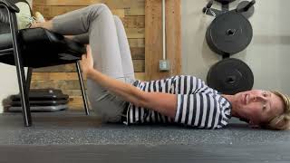 Hamstring bridge on chair