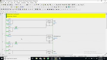 program simulasi pintu garasi otomatis menggunakan aplikasi CX-Programmer dan CX-Designer