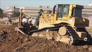 CAT D6 Bulldozer and CAT 815 Compactor At A Big Construction Site