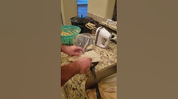 Spread masa on husk for tamales