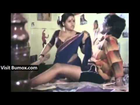 Indian servant purposely adjusting saree to show navel