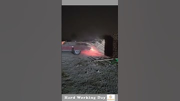 The Process Of Unloading Wood From A Vehicle