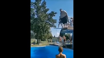 A fat man jumping in the swimming pool