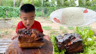 Little boy cook braised pork belly and cooked rice / Seyhak like his work so much