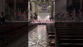 Il duomo in Milano, Italy. Orchestra rehearsal withmusic from Il postino by Enrio Morricone