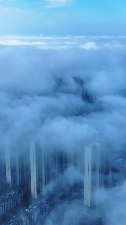 The city was shrouded in thick fog this morning, making it appear and disappear intermittently