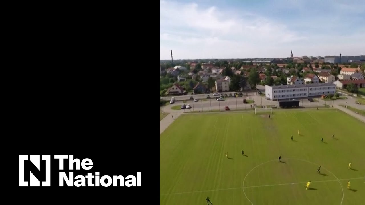 Skydiver receives yellow card for interrupting football match