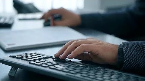 Man Typing On Computer Stock Video