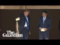 Trump and abe dump fish food into precious koi pond