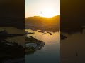 Vertical video. Bodrum, Turkey. Morning aerial drone view of Tiger Tower hill in backlight, yacht...