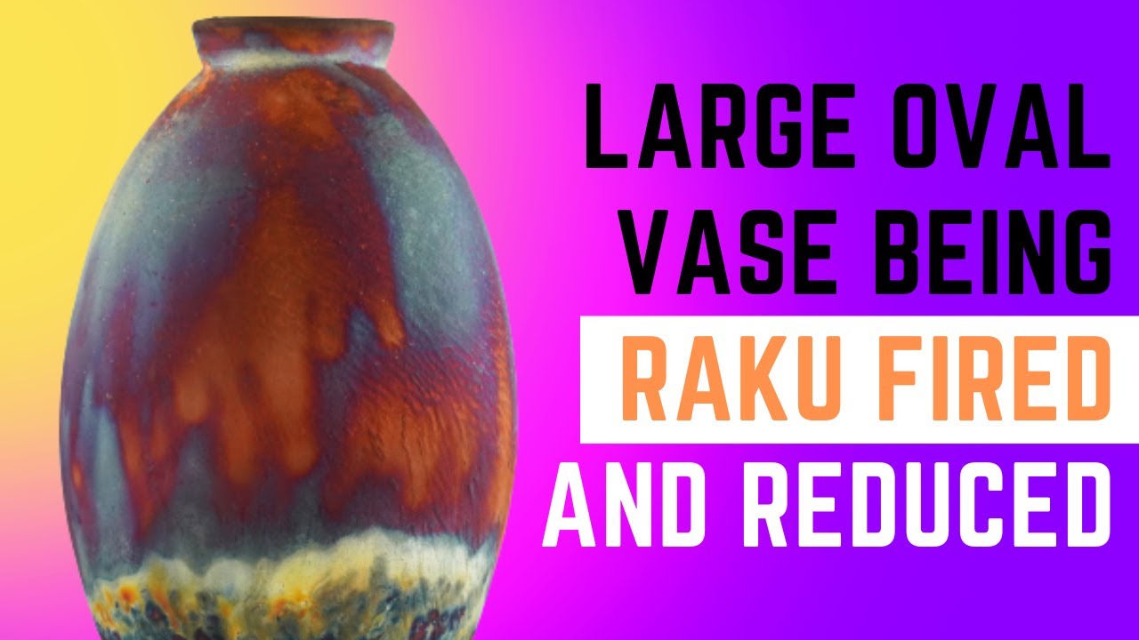Large ceramic pottery Oval Vase being Raku fired and reduced - From kiln to being painted by fire!