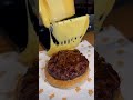 Cheese scraping onto burger