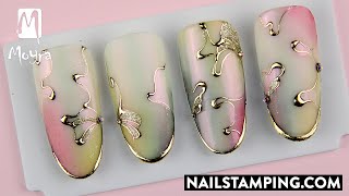 Hand-painted waves effected with shiny nail foil (nailstamping.com)