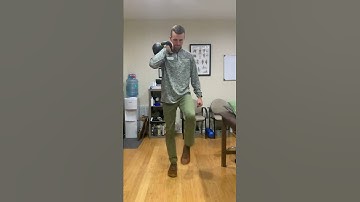 Stationary offset front rack KB hold performing alternating high knee march