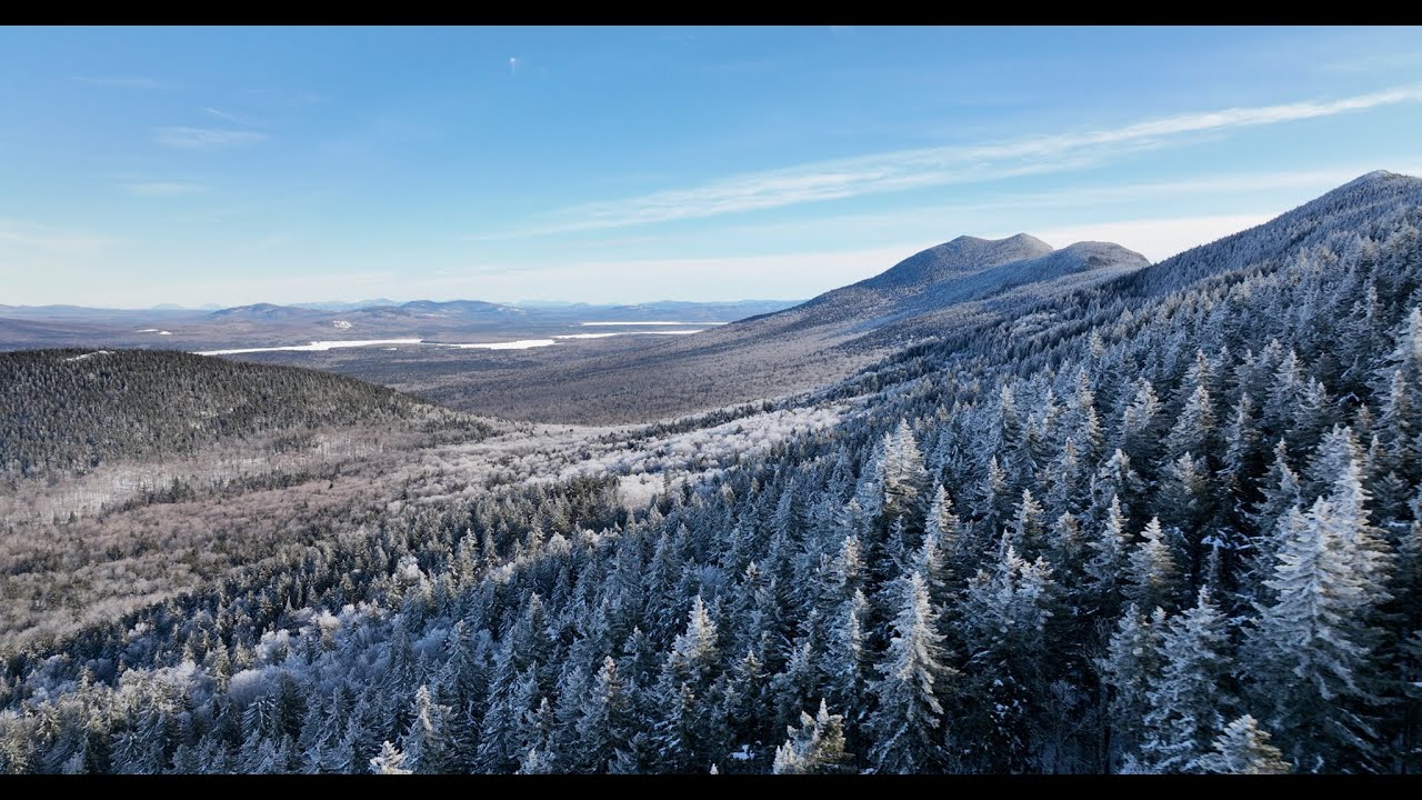 Bigelow Mountain 🏔 frosted in snow ️ covered trees 🌲🌳 as seen in a