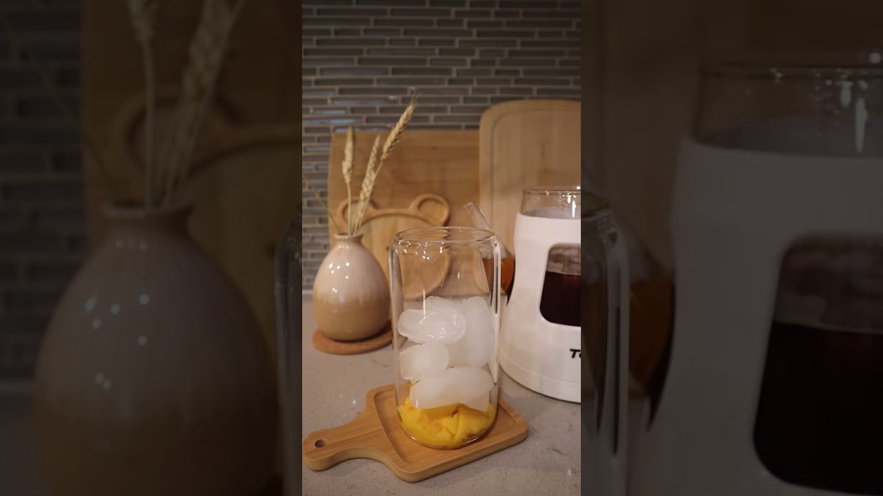 Black Tea with Peach Yogurt Juice, Fresh Mango, and Topped with Sweet