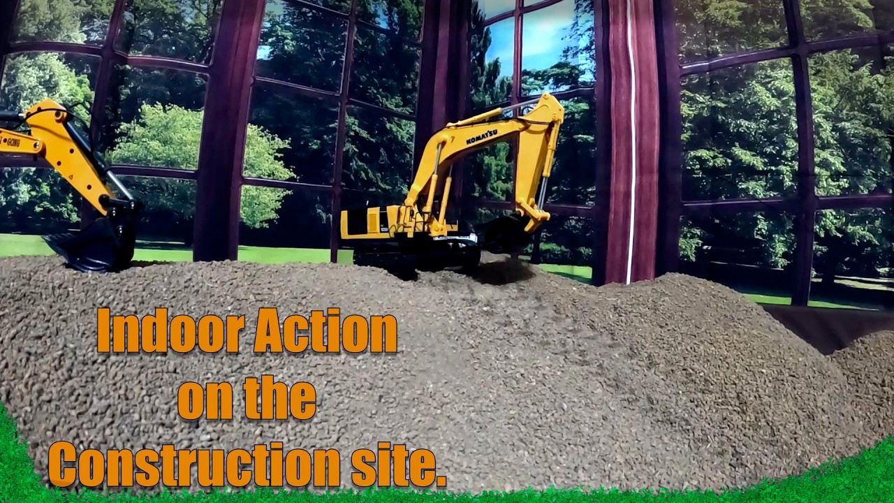 Having some fun with the 1/50 scale construction RC's. Indoor action.