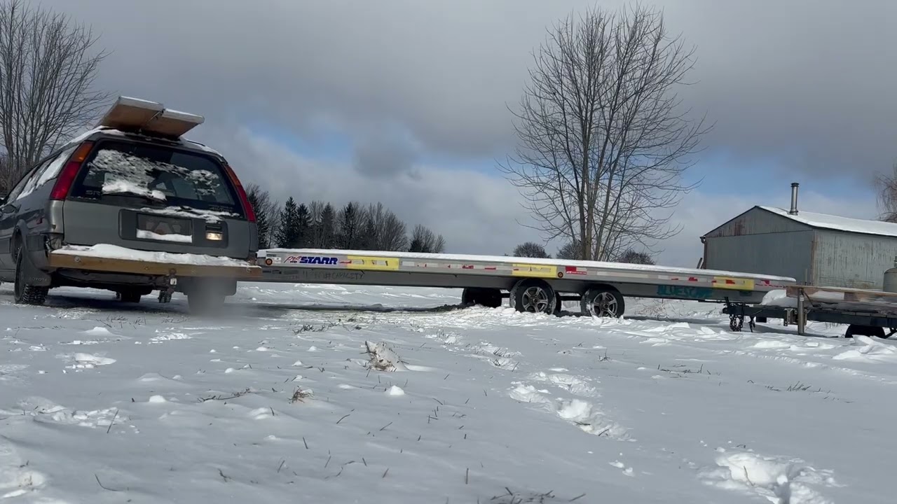 Using the alltrac Toyota Corolla wagon to pull my 24 foot trailer out of a snowbank