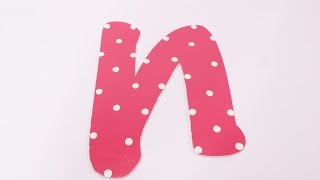 Paint White polka dots on pink letters