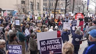 Protesters rally in support of Wisconsin judge outside federal courthouse while she enters plea