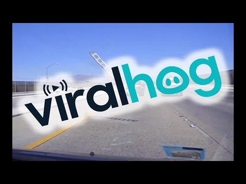 Loose Ladder Launches into Car Windshield || ViralHog