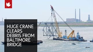 Huge floating crane swings into action to clear Baltimore bridge debris