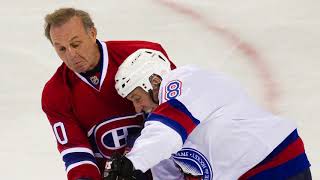 As New York Rangers Phil Esposito, left, tangles with Pittsburgh