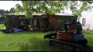 Tearing down a dilapidated garage.