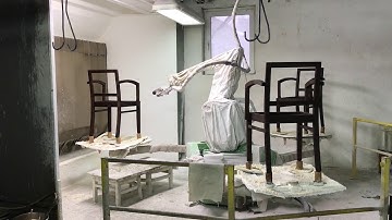 Robot painting a chair