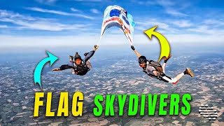 Six Skydivers Ascending Together as Two Hold a Flag