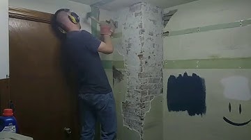 Removing plaster from chimney to expose brick