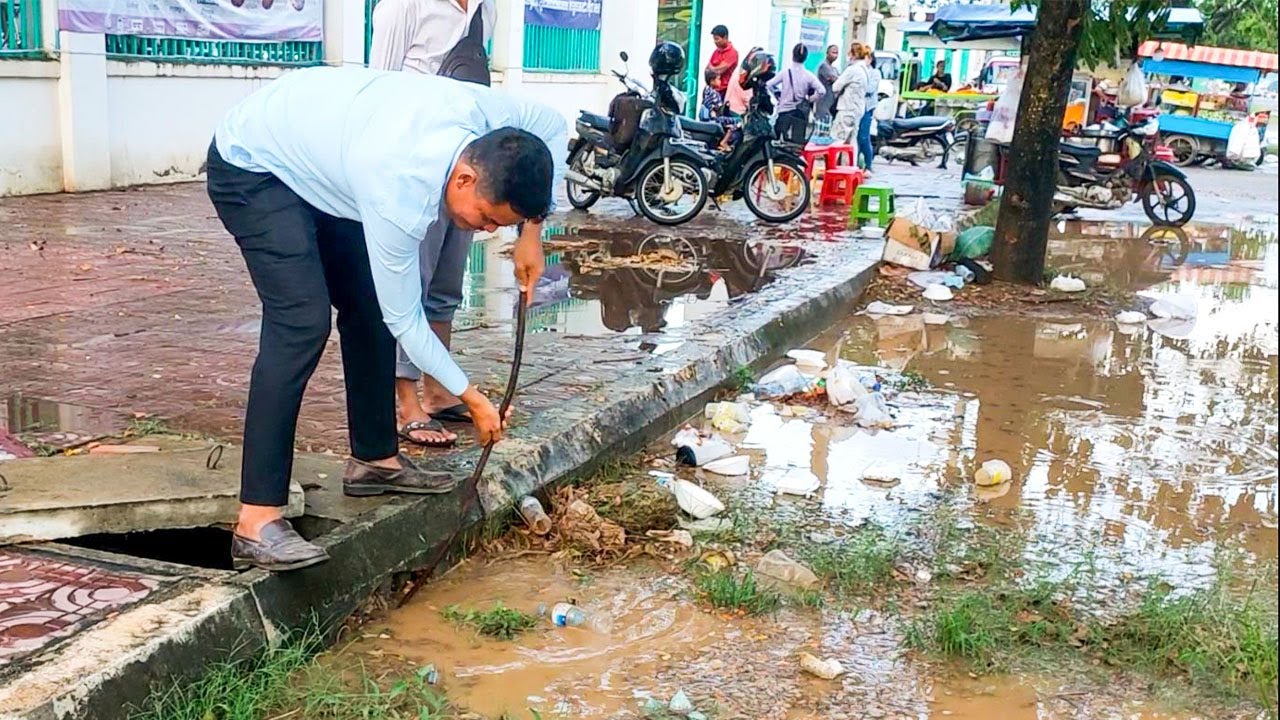 Unclogging Culvert Drain To Remove Rain Flood On Street Road After ...