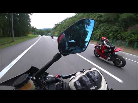 A female BMW S1000RR rider chases 2 Dudes on a Panigale