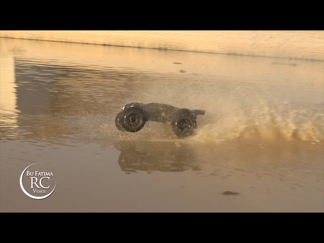 traxxas e revo crossing the lake in full speed with paddle 